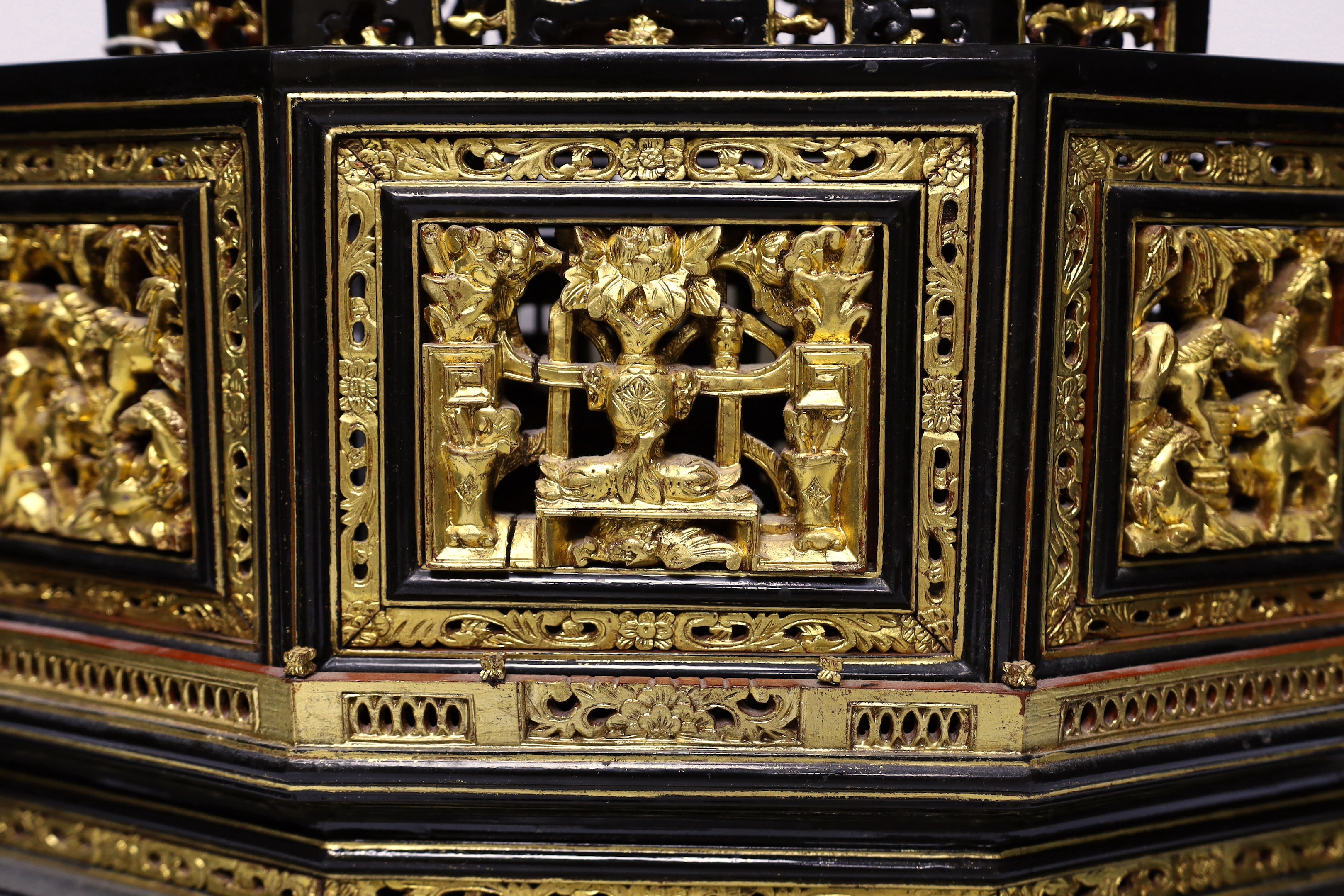 A 20th century Chinese carved lacquered wood altar stand, 49cm wide
